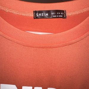 Light orange happiness shirt.